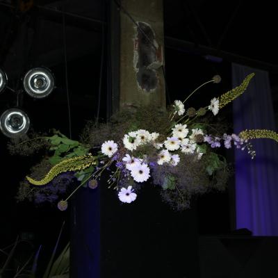 Cascading white daisy and hanging amaranth floral installation at the Moodyman event, Haus der Visionäre.